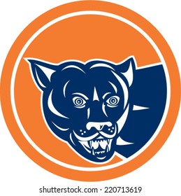 Illustration of a puma mountain lion head prowling set inside circle on isolated background done in retro style. 