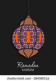 Illustration of Ramadan Kareem with intricate Arabic lamp for the celebration of Muslim community festival.