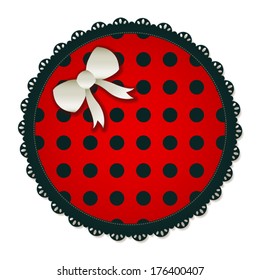 Illustration of a red & black circle textile patch. Accented with a small white bow. Eps 10 Vector.