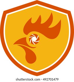 Illustration of a rooster head with camera shutter eye set inside shield crest done in retro style. 