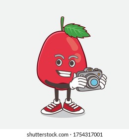 Ilustración de la mascota de dibujos animados Rose Hip Fruit como fotógrafo en acción con una cámara
