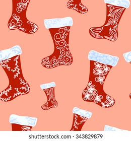Illustration is seamless vector pattern in red, blue and peach colors. Image consists of different Christmas boots, that are decorated with white and blue ornament. 