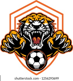 The illustration shows a sport emblem represented by a wild tiger that's trying to catch a soccer ball. 