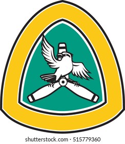 Illustration of a shrike, a carnivorous passerine birds of the family Laniidae perching propeller blade looking to side with spread wings front inside shield crest isolated background in retro style. 