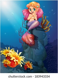 Illustration of a smiling mermaid sitting above the rocks