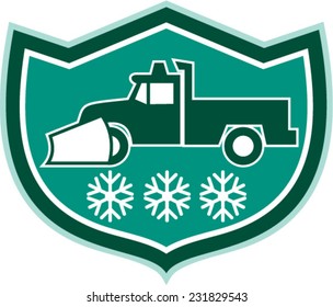 Illustration of a snow plow truck with snowflakes set inside shield crest  on isolated background done in retro style.