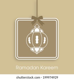 Illustration of stylish tag,sticker,label or greeting card of arabic lamp for celebration of Ramadan Kareem and Eid Mubarak.