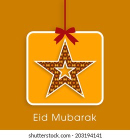 illustration of stylish tag,sticker,label or greeting card of Eid Mubarak with intricate star design.