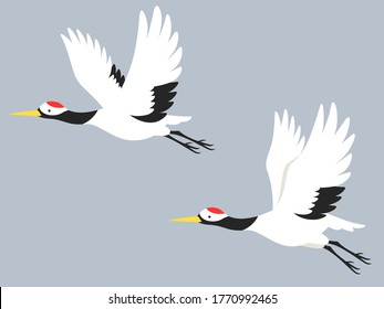 Illustration of two cranes flying