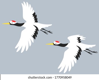 Illustration of two cranes flying in the sky