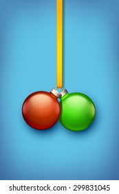 illustration of two xmas balls red and green color on blue background