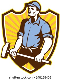 Illustration of a union worker with sledgehammer hammer done in retro style set inside shield crest with sunburst on isolated white background.