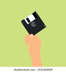 Illustration Vector Graphic Flat Design of Retro Classic Floppy Disk With Hand  90's Vibe. Suitable for creative industries, multimedia, entertainment, and other related businesses.