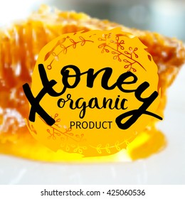 Illustration of vector hand drawn writing honey logo, label, badge in modern ink calligraphy style. Natural bee products. Yellow spot of honey with the bee and honeycomb logo