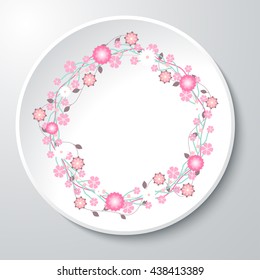 Illustration of vector plate with floral print. Floral pattern on a white plate. Wreath of varied flowers with green leaves as a curb on the decorative plate.