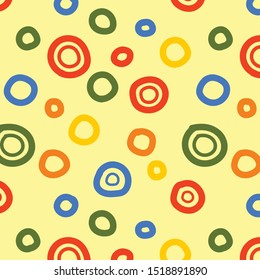 Illustration vector of seamless pattern of colorful hand drawn circle shape on yellow background for textile or fabric design and other artworks.