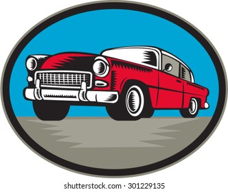 Illustration of a vintage classic car viewed from low angle set inside oval shape done in retro woodcut style.