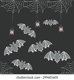 illustration of web dangling spiders and bats carved