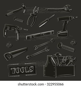 Illustration with working tools on a dark background .