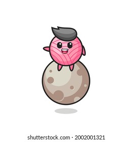 illustration of yarn ball cartoon sitting on the moon , cute style design for t shirt, sticker, logo element