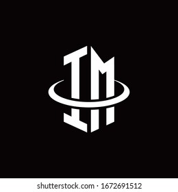 IM monogram logo in a hexagon style and surrounded by a ring