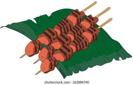 Image of Asian dish sate on a banana leaf