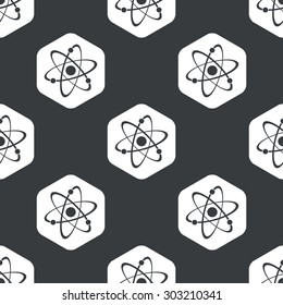 Image of atom in hexagon, repeated on black