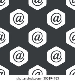 Image of at-sign in hexagon, repeated on black
