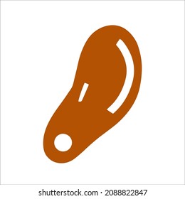 Image of a body part of an orange ear on the head with a pierced lobe