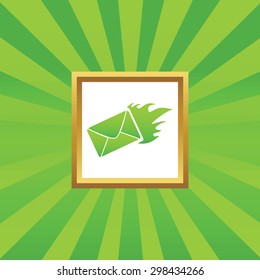 Image of burning envelope in golden frame, on green abstract background