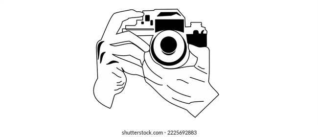 
image of the camera logo and the position of the hand being photographed