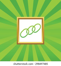 Image of chain fragment in golden frame, on green abstract background