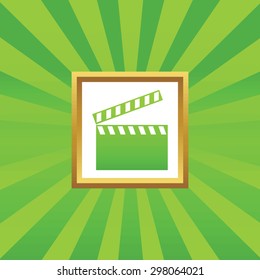 Image of clapperboard in golden frame, on green abstract background