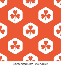 Image of clover leaf in white hexagon, repeated on orange background