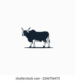 Image of a cow with horns standing on the ground