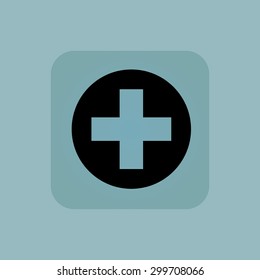Image of cross in painted circle, in square, on pale blue background