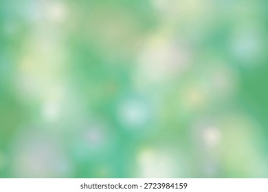 A imagem mostra um plano de fundo borrado com matiz verde predominante. A imagem está fora de foco, criando uma atmosfera suave e sonhadora com vários tons de verde e tons de branco e azul. O efeito geral é calmante e sereno, evocando uma sensação de natureza e tranquilidade.