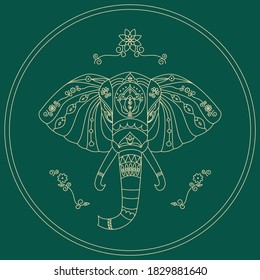 Image of an elephant head with ornament on a green background. To illustrate the Indian theme.