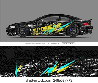 The image features a black car with a vibrant yellow, black, and blue wrap, ideal for automotive advertisements and marketing campaigns.