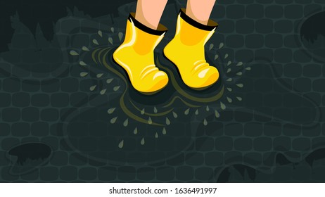 Image of feet of a child in yellow rubber boots jumping in puddles