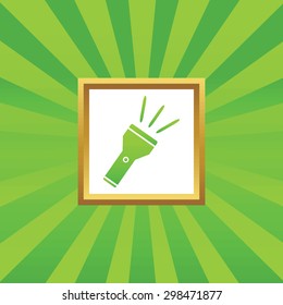 Image of flashlight in golden frame, on green abstract background
