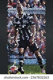 It's an image of a football player and a soccer ball cut and pasted out of cardboard. There are cheerleaders and football fans in the background.