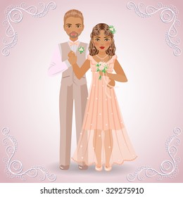 The image in full-length of blond bridegroom in beige suit and brown-haired bride in cream dress on light pink background.