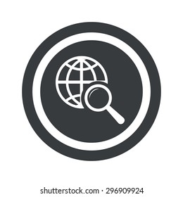 Image of globe under loupe in circle, on black circle, isolated on white