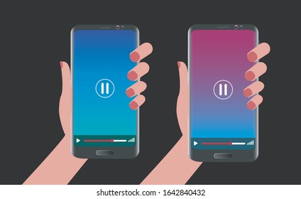 Image of a hand holding a mobile. Mobile screen in video mode. Mobile mock up. Black background