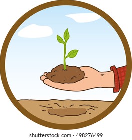 image of a hand planting a plant in the ground