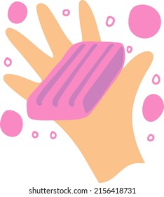
Imagen de una mano con jabón o soplo. Burbujas rosas vuelan por ahí.
