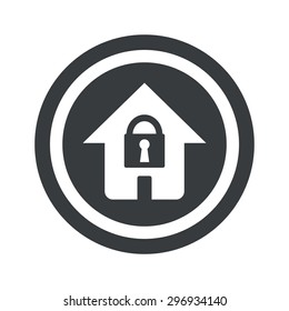 Image of house with closed padlock in circle, on black circle, isolated on white