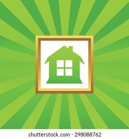Image of house with window in golden frame, on green abstract background
