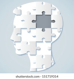 Image of a human face in the form of a jigsaw puzzle with a gray mid. business concept